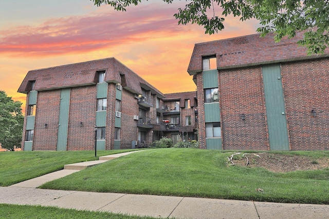 view of outdoor building at dusk