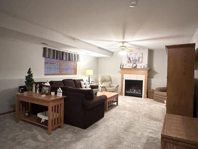 living room with carpet, a fireplace, and ceiling fan