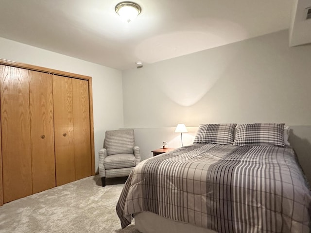 bedroom with carpet and a closet