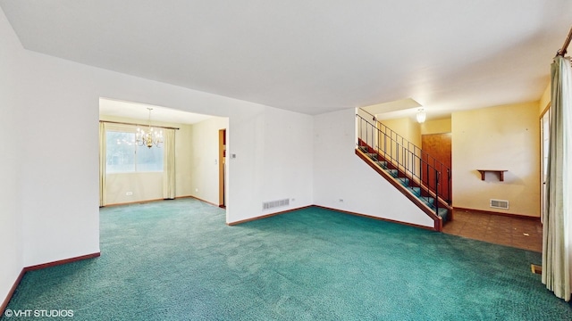 unfurnished living room featuring dark carpet and a chandelier