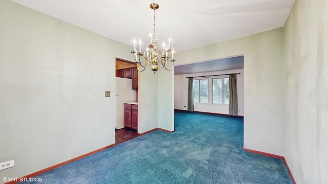 unfurnished dining area featuring a notable chandelier and dark colored carpet