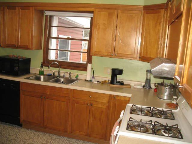 417 N Park Ave, Aurora, IL 60506 - kitchen featuring light tile patterned floors, sink, and black appliances