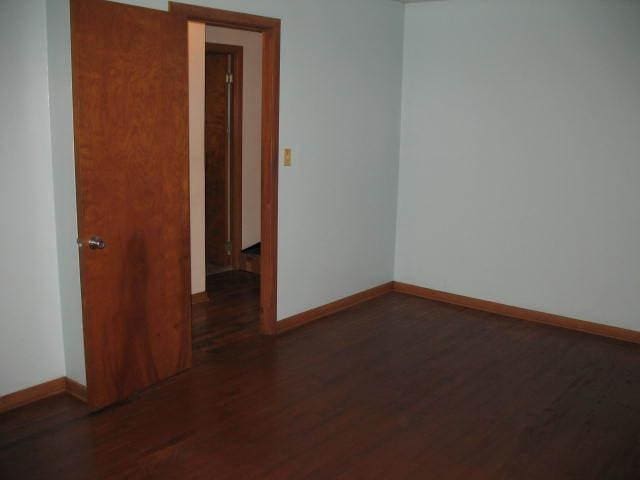 417 N Park Ave, Aurora, IL 60506 - spare room featuring dark hardwood / wood-style floors