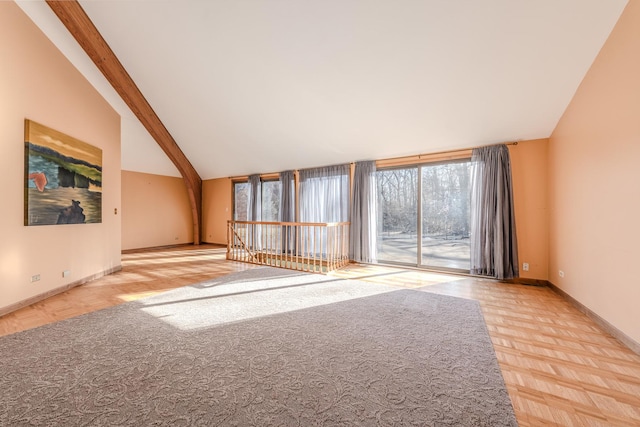 unfurnished living room with high vaulted ceiling