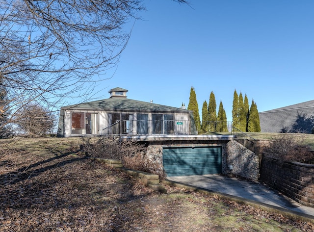 back of property with a garage