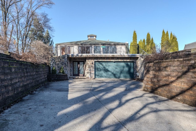 view of front of house with a balcony and a garage