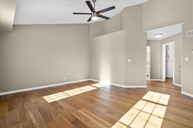 empty room featuring ceiling fan and hardwood / wood-style floors