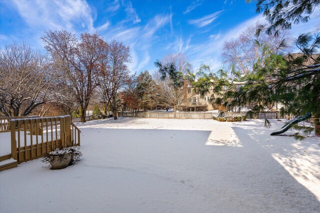 view of yard layered in snow