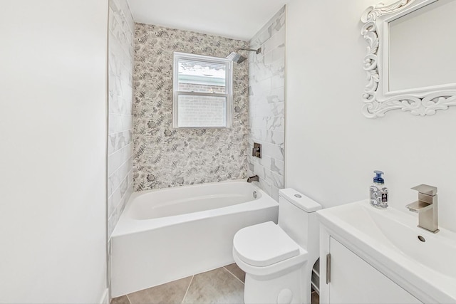 full bathroom featuring tile patterned floors, vanity, toilet, and tiled shower / bath combo