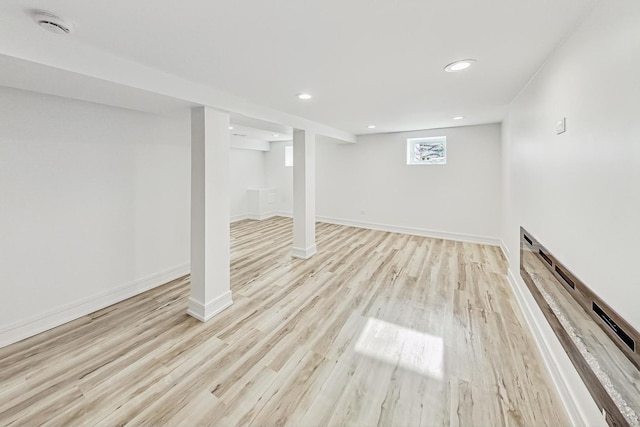 basement featuring light hardwood / wood-style flooring