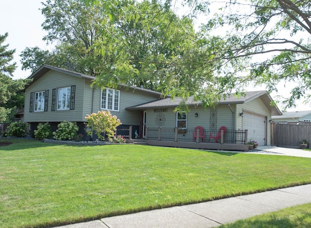 view of front of house with a front lawn and a garage