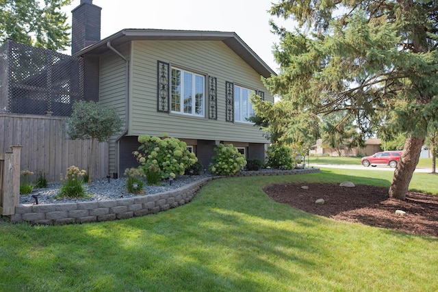 view of home's exterior featuring a yard