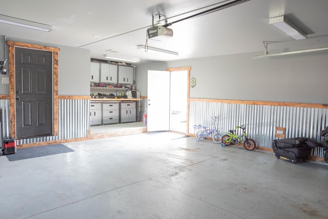 garage featuring a workshop area and a garage door opener