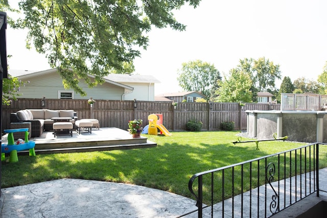 view of yard featuring outdoor lounge area and a wooden deck