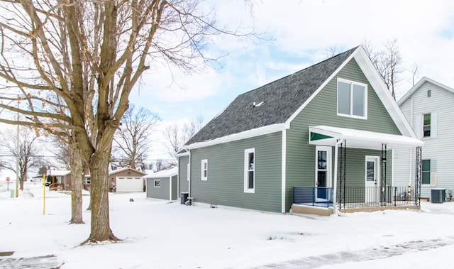 view of front of property featuring central AC unit and covered porch