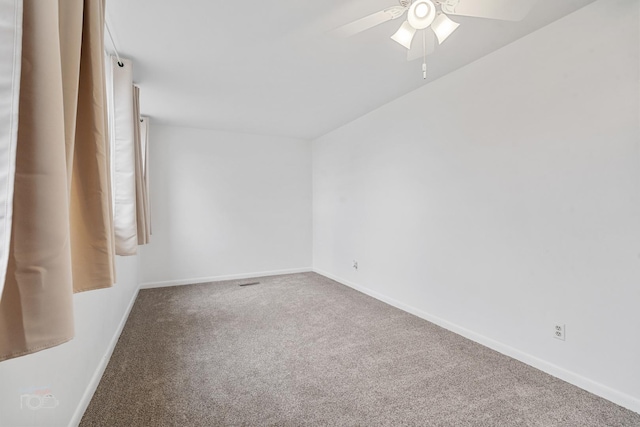 carpeted empty room with ceiling fan