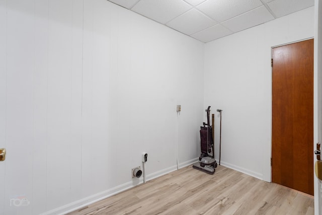 laundry area with light hardwood / wood-style floors