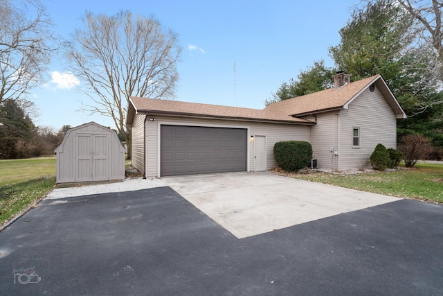 view of front of home with a shed and a front lawn