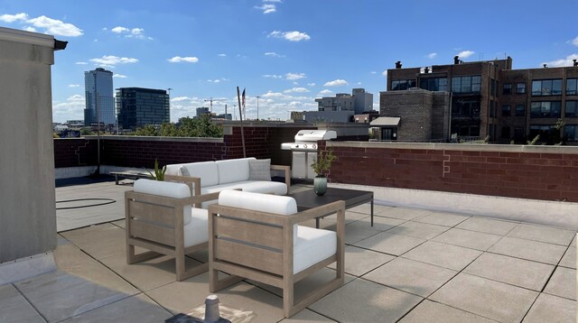 view of patio with grilling area and outdoor lounge area