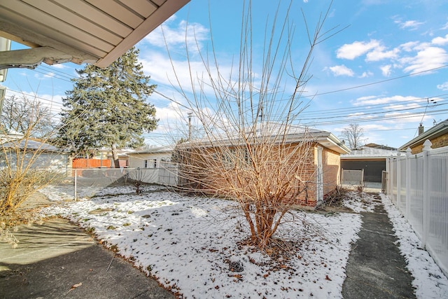 view of yard covered in snow