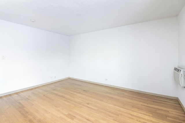 unfurnished room with light wood-type flooring