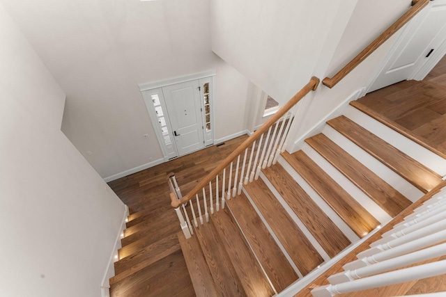 stairs with hardwood / wood-style floors