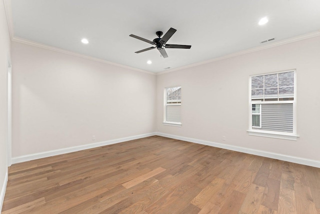 unfurnished room featuring light hardwood / wood-style flooring, ceiling fan, and crown molding