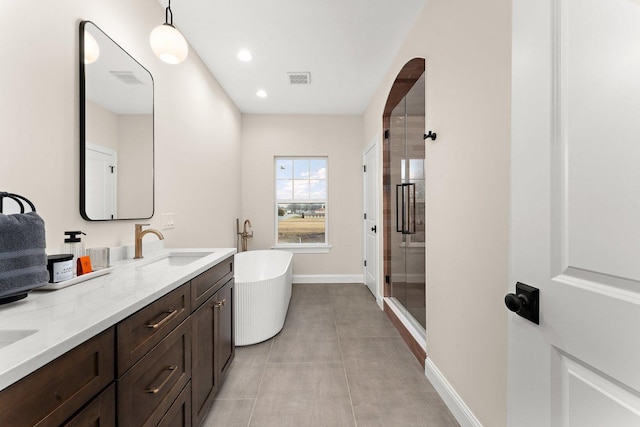 bathroom featuring shower with separate bathtub and vanity