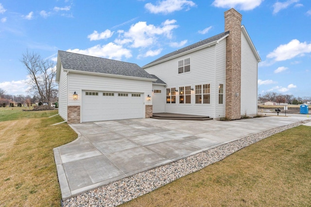 exterior space with a lawn and a garage