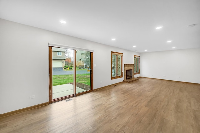 unfurnished living room with light hardwood / wood-style flooring