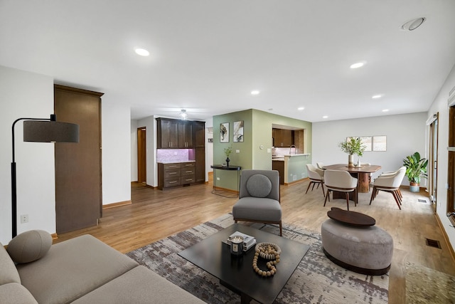 living room with light hardwood / wood-style floors