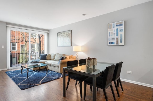 dining space featuring hardwood / wood-style flooring