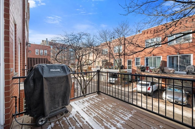 wooden terrace featuring grilling area