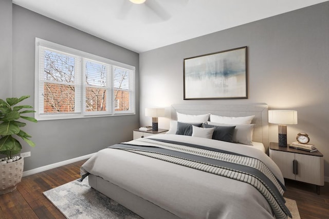 bedroom featuring ceiling fan and dark hardwood / wood-style floors