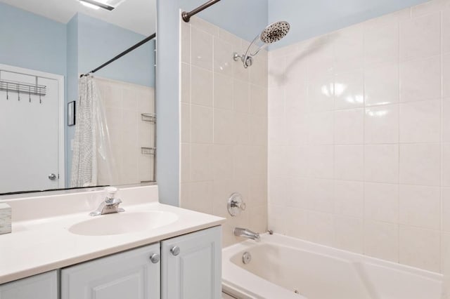 bathroom featuring shower / bath combo and vanity