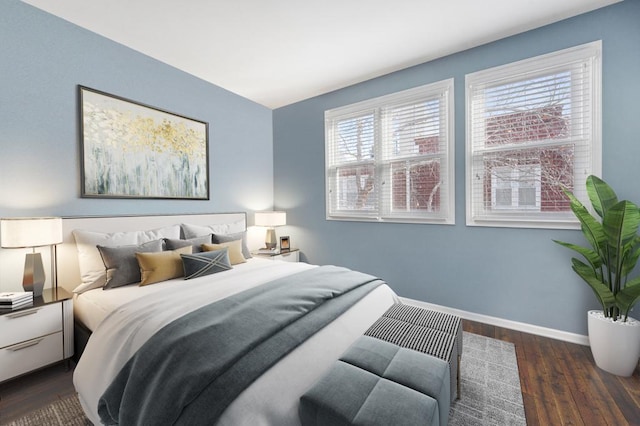 bedroom with dark hardwood / wood-style floors