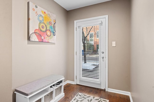 doorway to outside with dark wood-type flooring