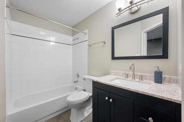 full bathroom with tile patterned flooring, vanity, toilet, and tiled shower / bath