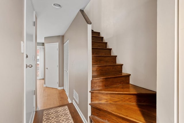 staircase featuring hardwood / wood-style flooring