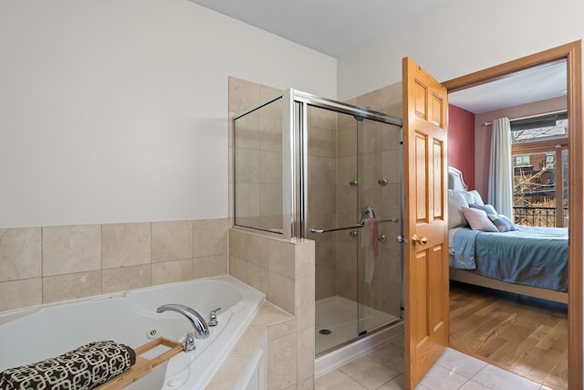 bathroom with tile patterned flooring and plus walk in shower