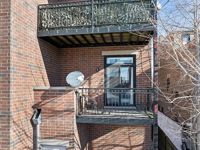 doorway to property with a balcony