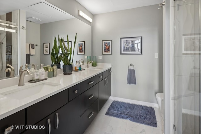 bathroom featuring marble finish floor, double vanity, a sink, and a shower stall