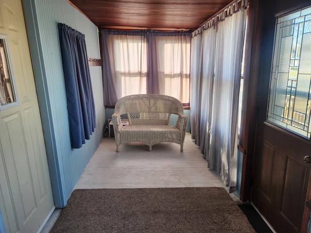 sunroom featuring wood ceiling