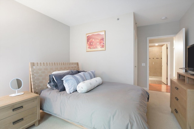 bedroom with light colored carpet