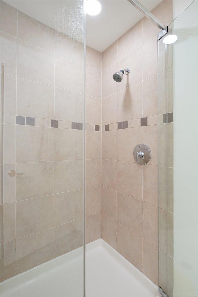 bathroom featuring an enclosed shower