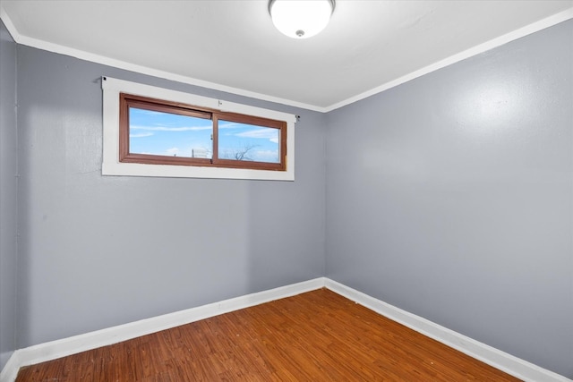 unfurnished room featuring crown molding and wood-type flooring