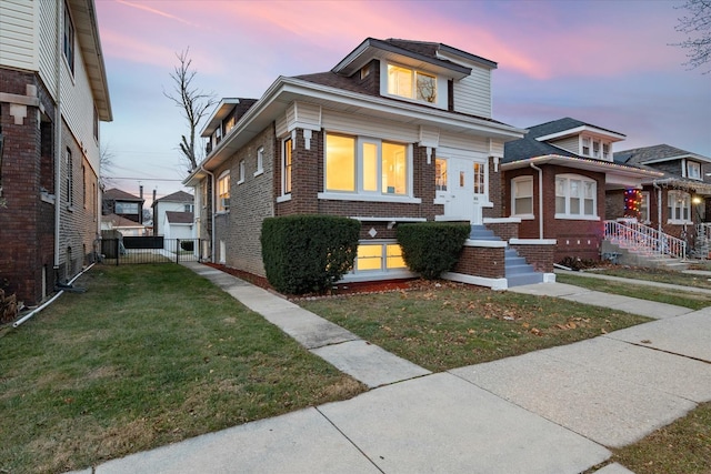 bungalow featuring a lawn