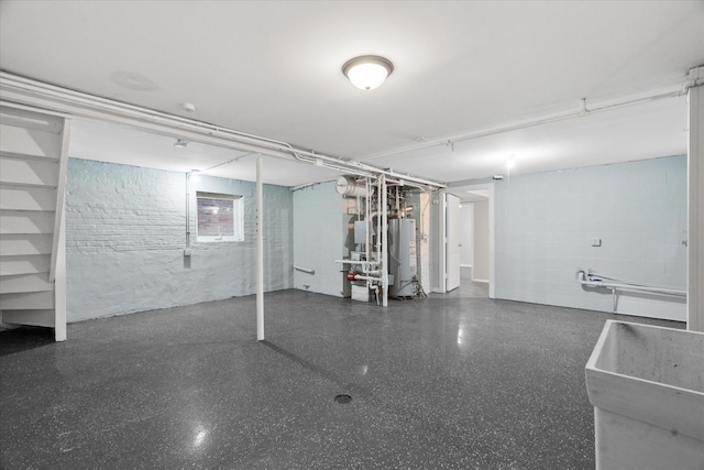 basement featuring water heater and sink