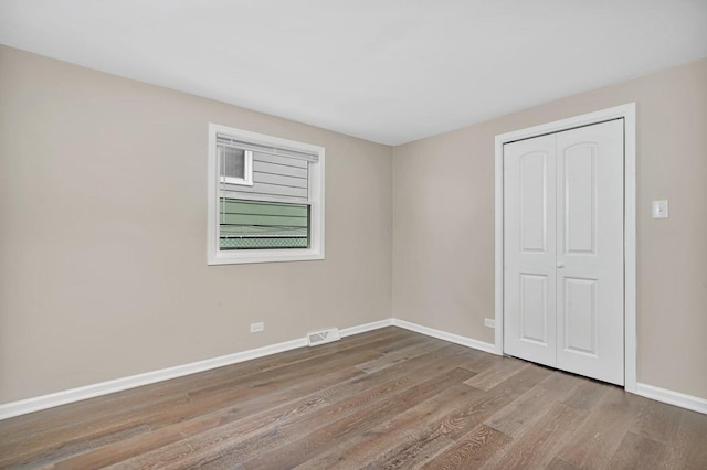 spare room featuring hardwood / wood-style floors