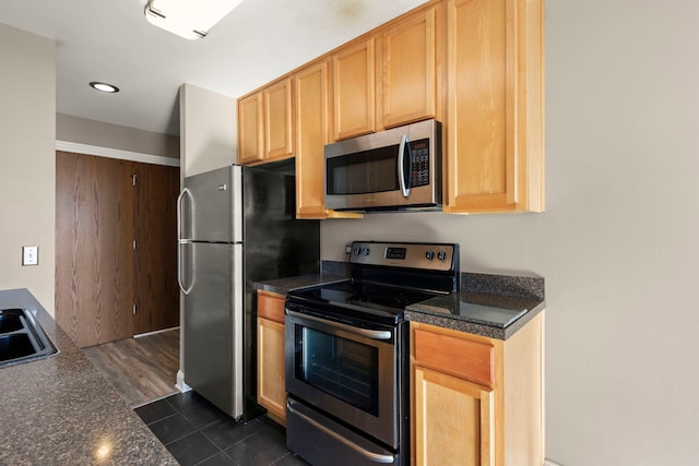 kitchen with sink, light brown cabinets, and appliances with stainless steel finishes